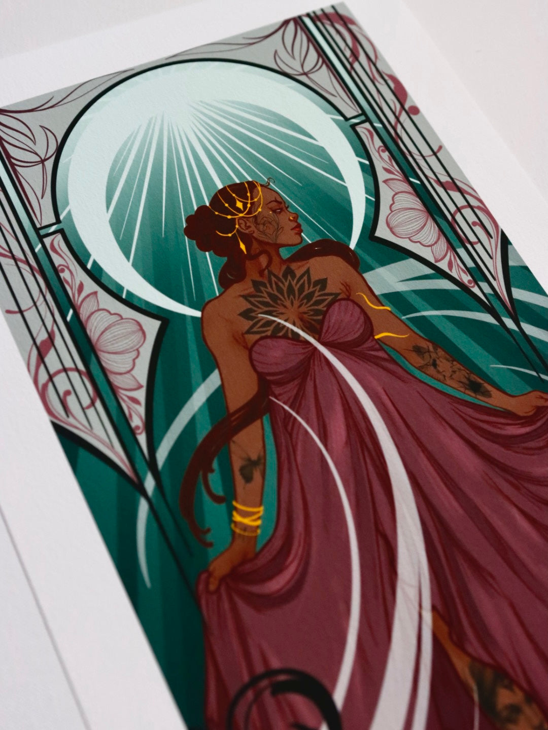 Artistic depiction of a woman in a flowing dress with decorative elements and a central light source.
